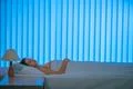 The beautiful woman sleeping on the bed. Evening night time Photo