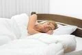 The beautiful woman sleeping on the bed Photo