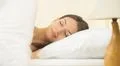 The beautiful woman sleeping on the bed Photo