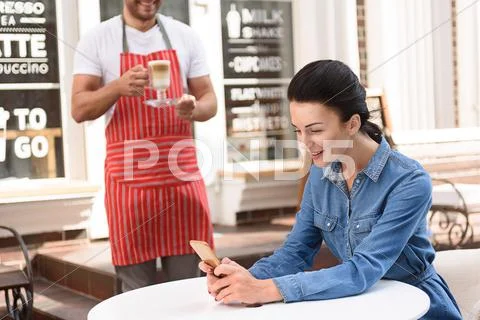 Beautiful woman spending time in coffee shop Stock Photos