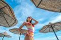 The beautiful woman stand in the beach on the sea background Photo