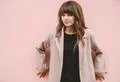 The beautiful woman stand on the pink wall background Photo