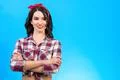 The beautiful woman standing on the blue background Photo