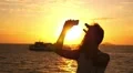 Beautiful Woman Taking Selfie against Sunset during Sea Cruise. Slow Motion. HD Footage