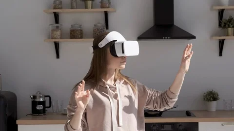 Beautiful woman touch something using modern virtual reality glasses Video stock 107882101