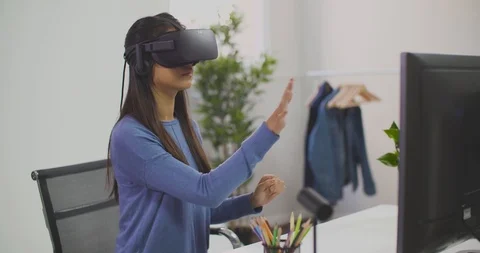 Beautiful woman touching something using modern virtual reality glasses Stock-Footage 100231856