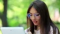 Beautiful woman uses tablet computer HD Footage