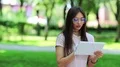 Beautiful woman uses tablet computer HD Footage