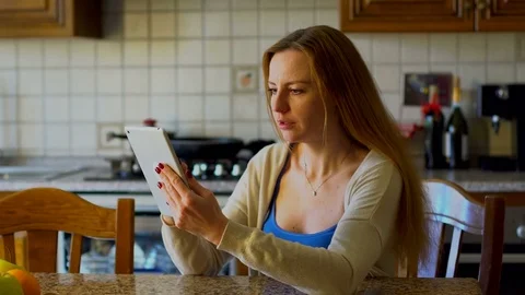 Beautiful woman using a computer tablet Stock Footage 73548859