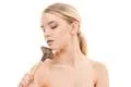 The beautiful woman using a cosmetic brush on the white background Photo