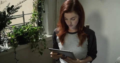 Beautiful woman using digital tablet Stock Footage 63373850