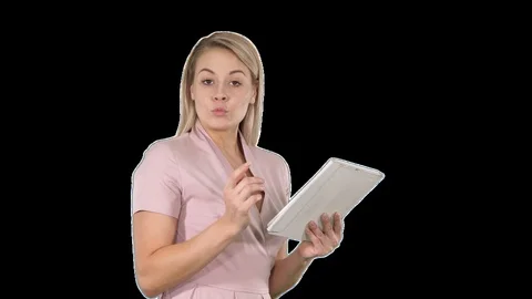 Beautiful woman using a digital tablet and talking to the camera, Alpha Channel Stock-Footage 115995959