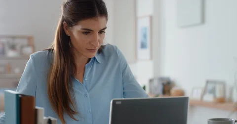 Beautiful woman using laptop computer browsing online checking messages enjoying Stock Footage 109515161