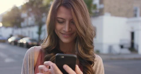 Beautiful woman using smart phone technology app in city Stock Footage 59148606