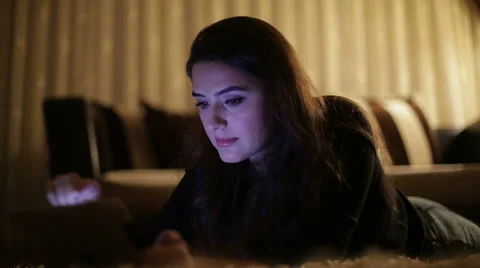 Beautiful woman using tablet computer touchscreen ıpad in home Stock Footage 44444565