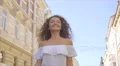 The beautiful woman walk on the street. Slow motion. Wide angle 4k or 4k+ Resolution