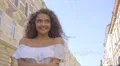 The beautiful woman walk on the street. Slow motion. Wide angle 4k or 4k+ Resolution