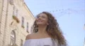 The beautiful woman walk on the street. Slow motion. Wide angle 4k or 4k+ Resolution