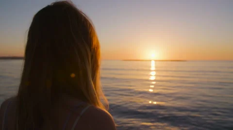  beautiful woman walking on the beach at sunset Stock Footage 59337560