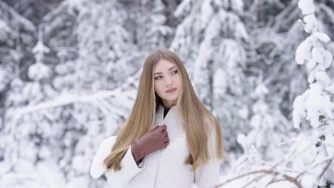 Beautiful woman in winter forest Stock Footage