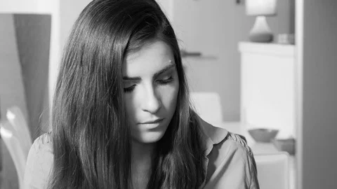 Beautiful woman at work in front of pc at home closeup black and white dolly Stock Footage 75869433