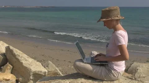 Beautiful woman working on laptop on the beach, businesswoman, business, sea, Stock Footage