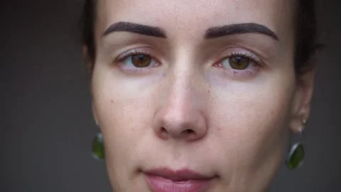 Beautiful woman’s eyes opening while looking at Camera, Stock Footage 140264236