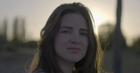 Beautiful woman’s eyes opening while looking at Camera, at sunset Stock Footage 156635883