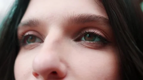 Beautiful womans eyes opening while looking at Camera, having long nice Video stock 241606059