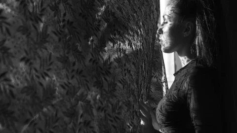 Beautiful woman's portrait with lace pattern shadow and sun light on her face Stock Footage 90173792
