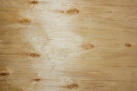 Beautiful wooden lights background. Relief plywood close-up. Wooden backgroun Stock Photos