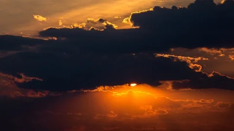 Beautiful yellow cloudscape with large sun Stock Footage 98295788