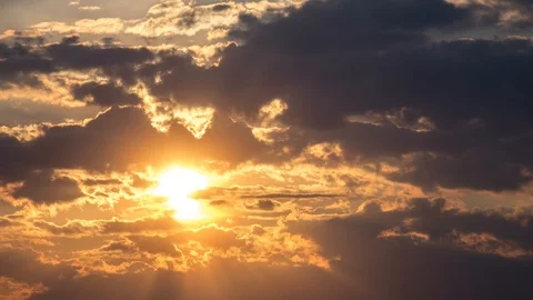 Beautiful yellow cloudscape with large sun Stock Footage 98305376