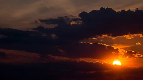 Beautiful yellow cloudscape with large sun Stock Footage 98531022