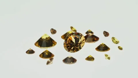 .beautiful yellow diamonds in different size on white background. Stock Footage 252433106