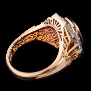 Beautiful yellow gold ring with a ruby on a black background 스톡 사진