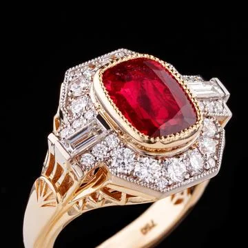 Beautiful yellow gold ring with a ruby on a black background Stock Photos