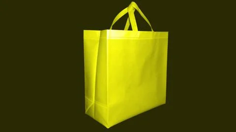Beautiful Yellow Non Woven grocery shopping bag with black background Stock Photos