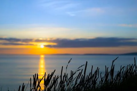 Beautiful yellow sunset over loop head Stock Photos