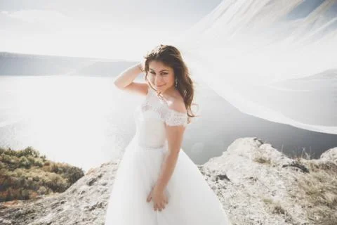 Beautiful young bride posing on the background sea Foto stock