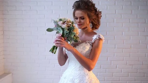 Beautiful young bride posing Stock Footage 68100172