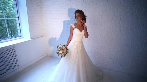 Beautiful young bride posing Stock Footage 68100380