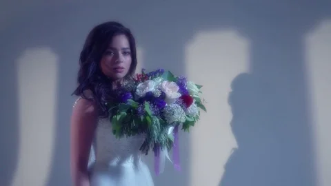 Beautiful young bride is posing with wedding bouquet Stock Footage 77333484