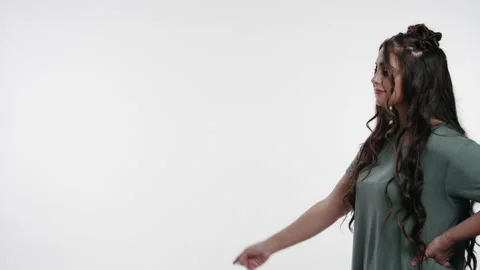 Beautiful young college student interacts with graphic space on white Stock Footage 153500724