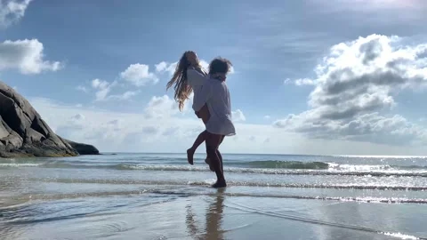 Beautiful young couple having fun on the tropical beach Stock Footage 135212249