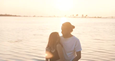 Beautiful young couple's dance in sunset time, beach. Romance, relationship a Stock Footage 156299177