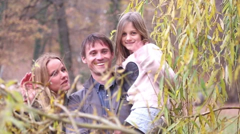 Beautiful young family waving Stock Footage 59554026