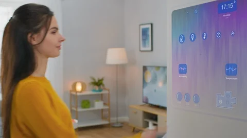 Beautiful Young Female Interact with Augmented Reality Display.  Climate Control Stock Footage 126153458