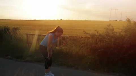 Beautiful Young Female Runner Exercising Resting Tired Stock Footage