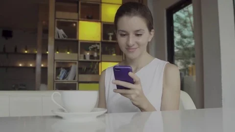 Beautiful young female using smartphone Stock Footage 81752005